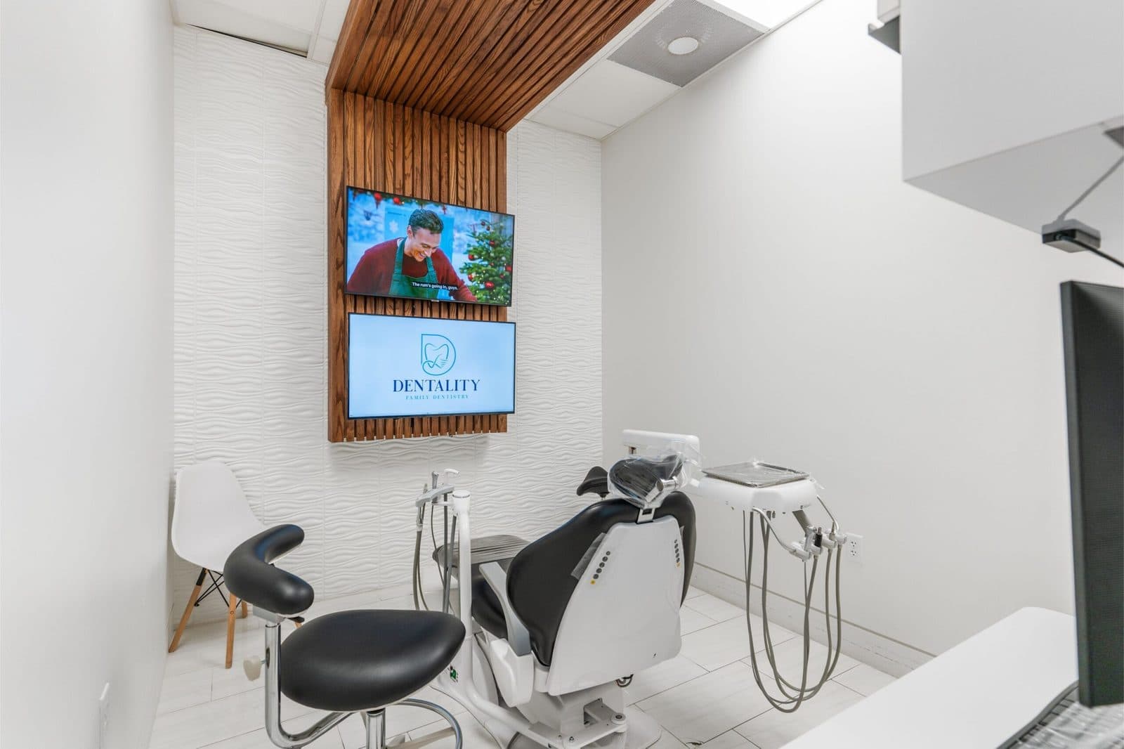 Treatment room with ceiling TV